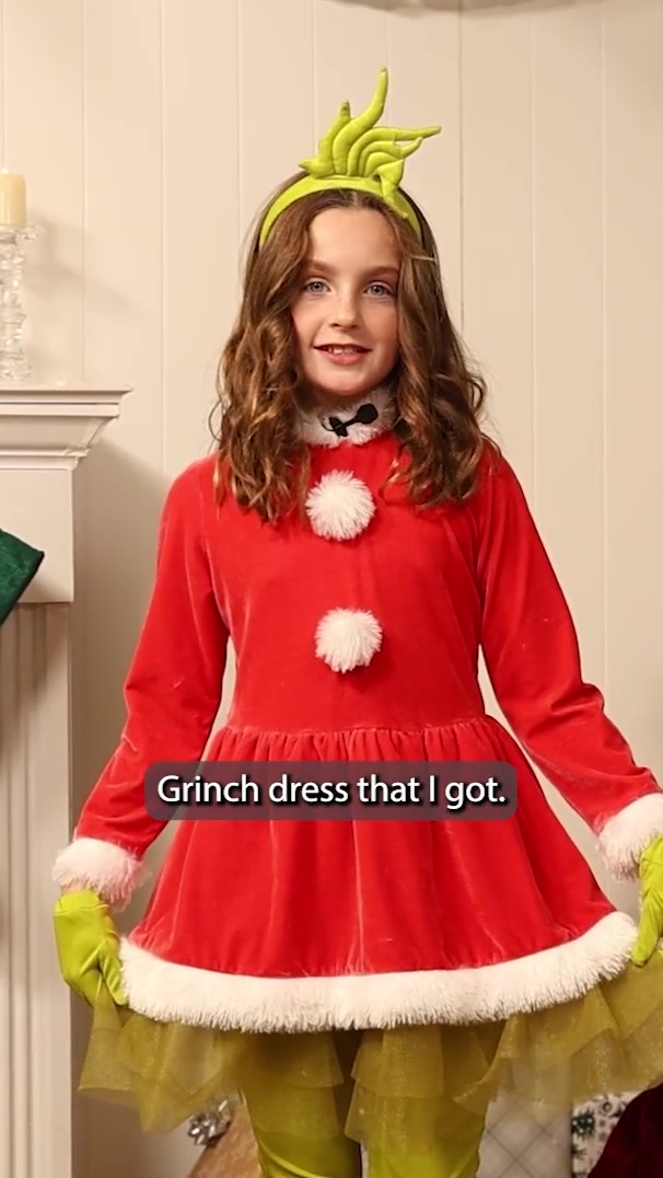 Bring the Whoville magic to life with our Dr. Seuss Girl's The Grinch Costume Dress! Inspired by the beloved Cindy Lou Who, this charming dress is the perfect pick for spreading holiday cheer this season!